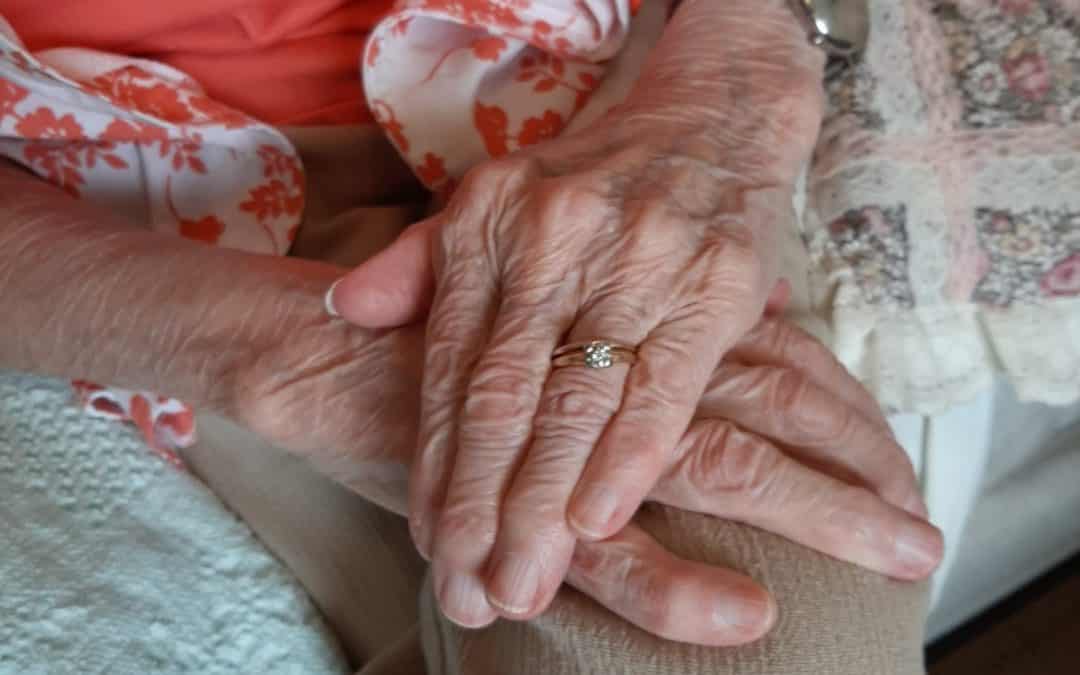 Sue's hands with gold ring
